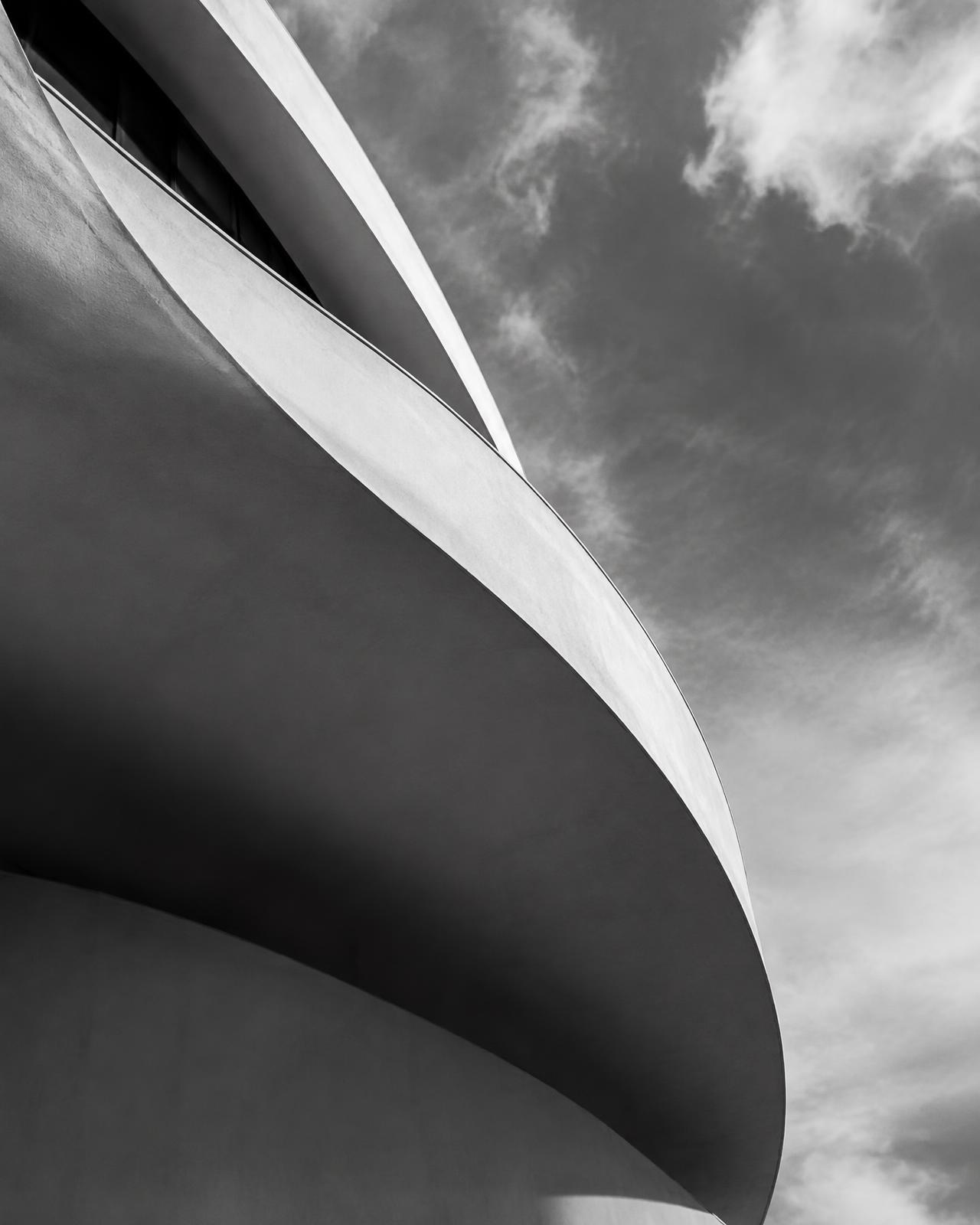 Black and white curved concrete facade